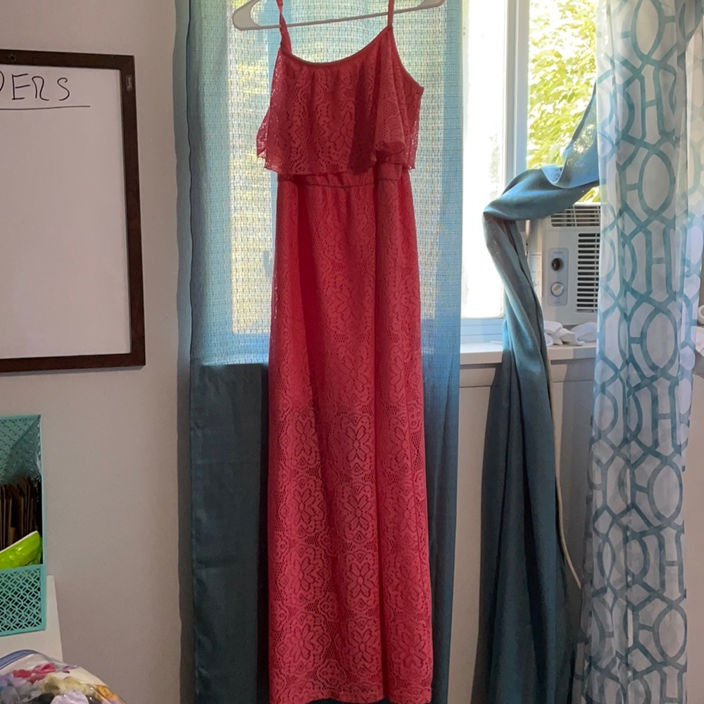 This dress is coral color and goes to your ankles.